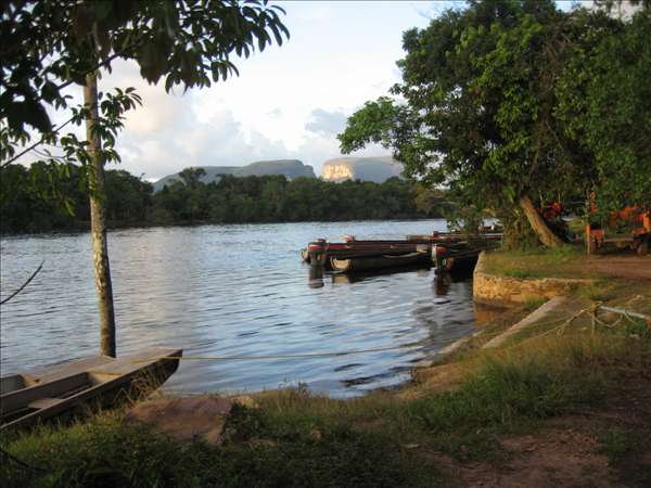 Canaima_Lagoon Much of Canaima’s accommodation is situated around the picturesque Canaima Lagoon, across which one can set out by canoe to reach the waterfalls and tepuis on the other side. The rich mineral content of the land around the lagoon turns the water and sand interesting colours.